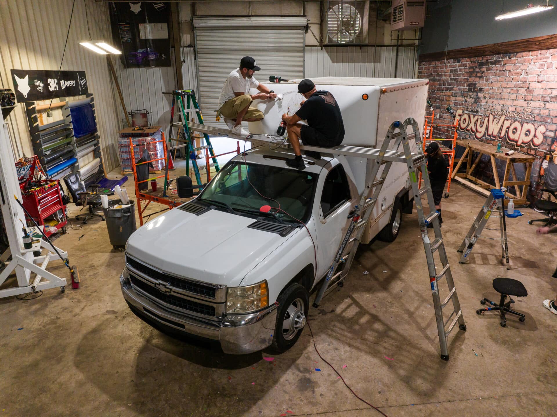 Vehicle Undergoing Vinyl Wrap Service