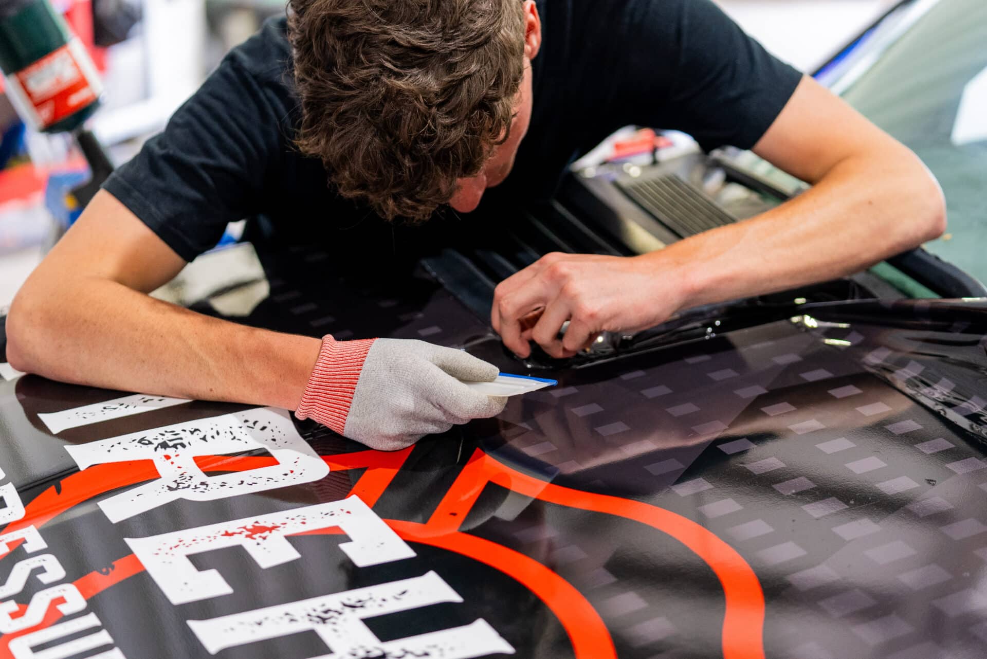 Technician Wrapping A Car